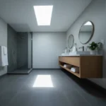 A finished bathroom addition with a glass shower, floating vanity, and skylight in a San Jose residential home.